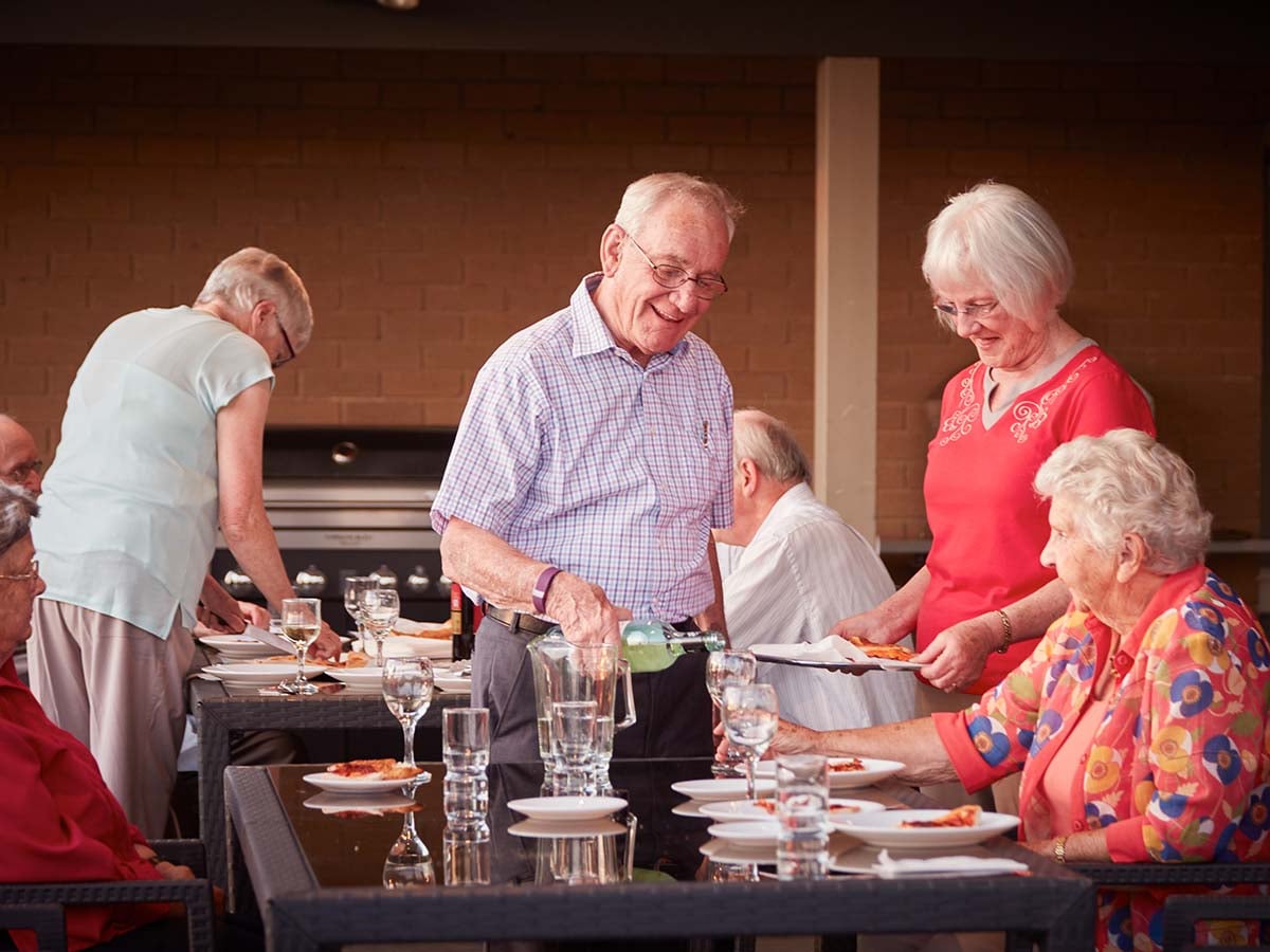 Oak Tree Hill residents having BBQ dinner