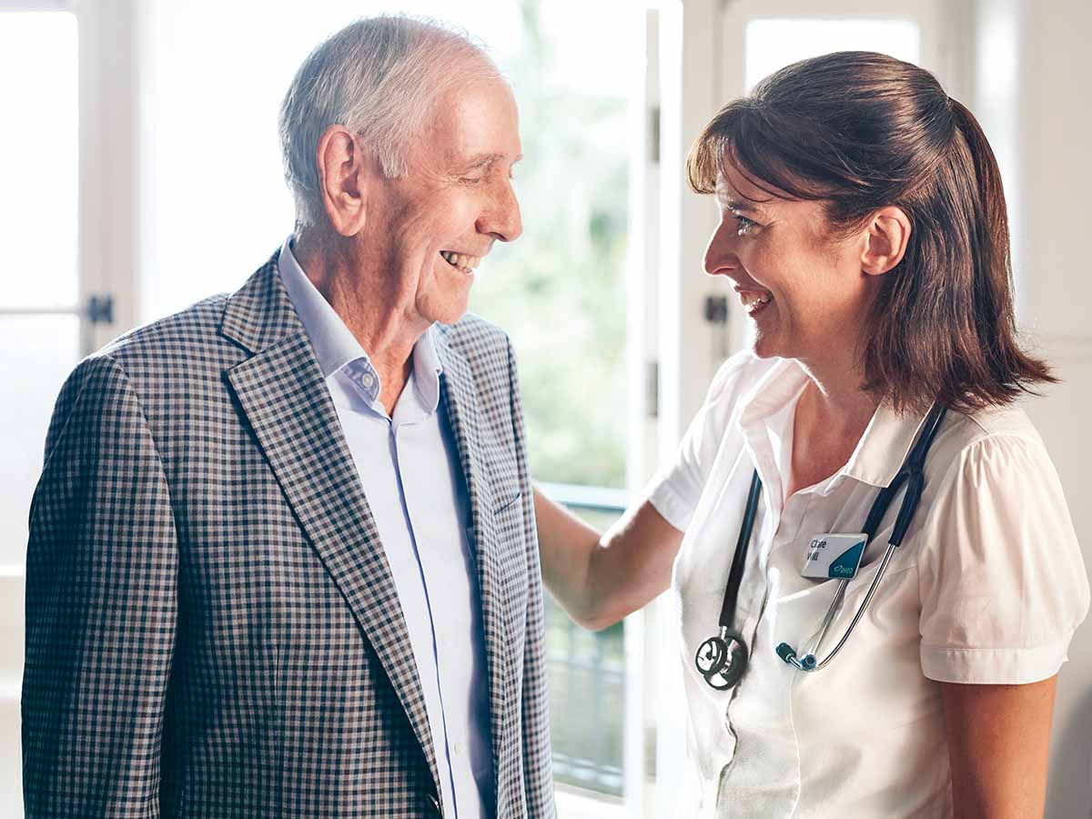 Man being greeted by nurse