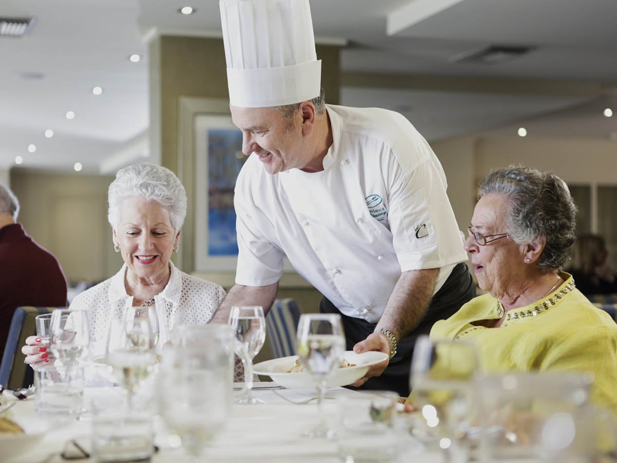 Residents having meal in restaurant