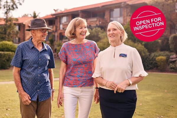 Open For Inspection Ad - Visitors walking with Aveo team member